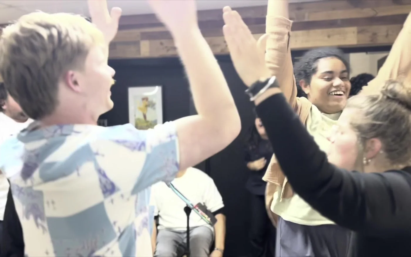 Hands raised in worship at DMI